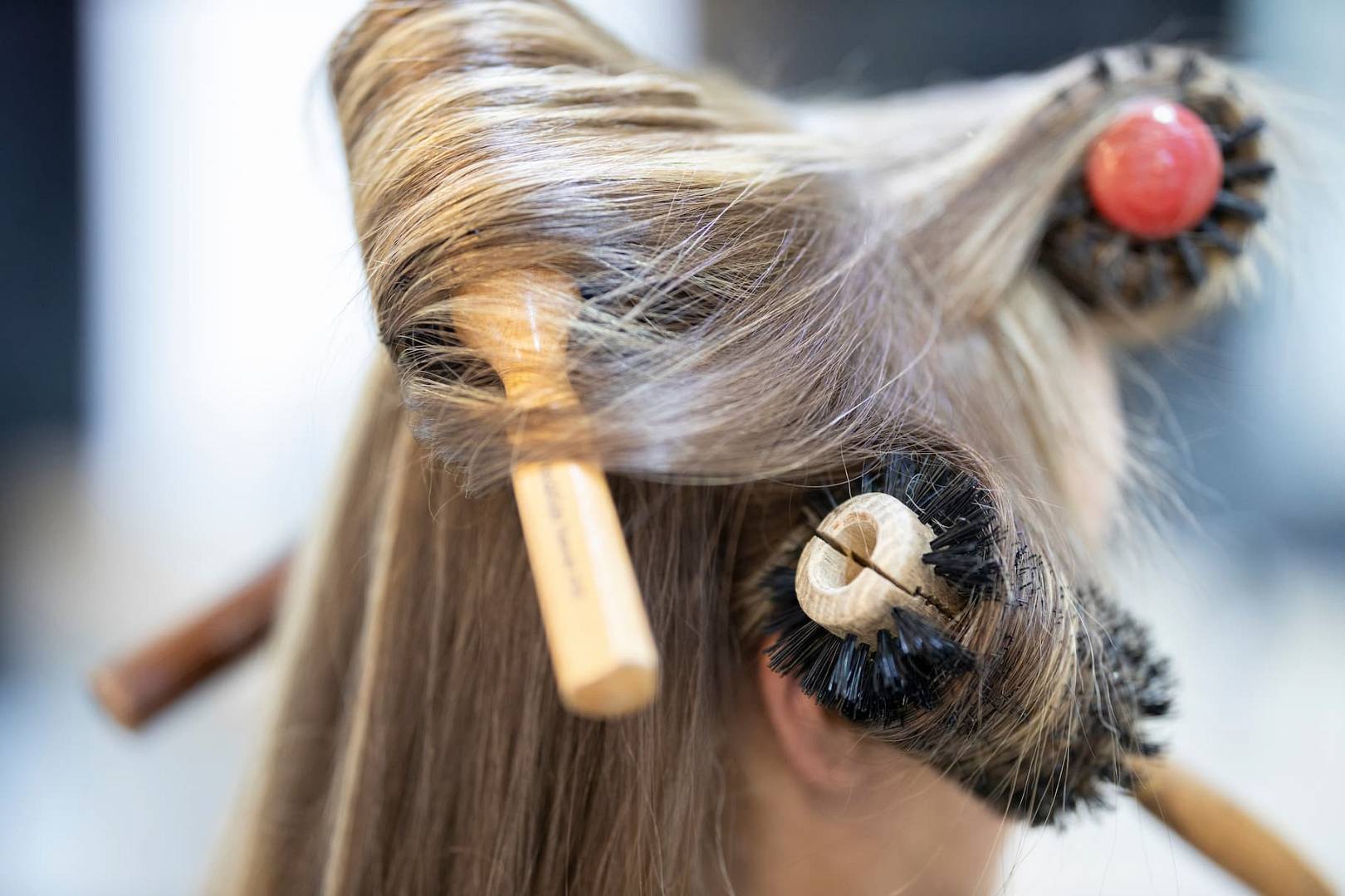 woman-with-hair-styling-brushes-extreme-close-up-2026-03-26-04-28-29-utc(1).jpg